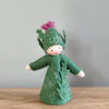 A felt Burdock Flower Fairy wearing a green dress and a pink flower in the hat with light skin tone | © Conscious Craft